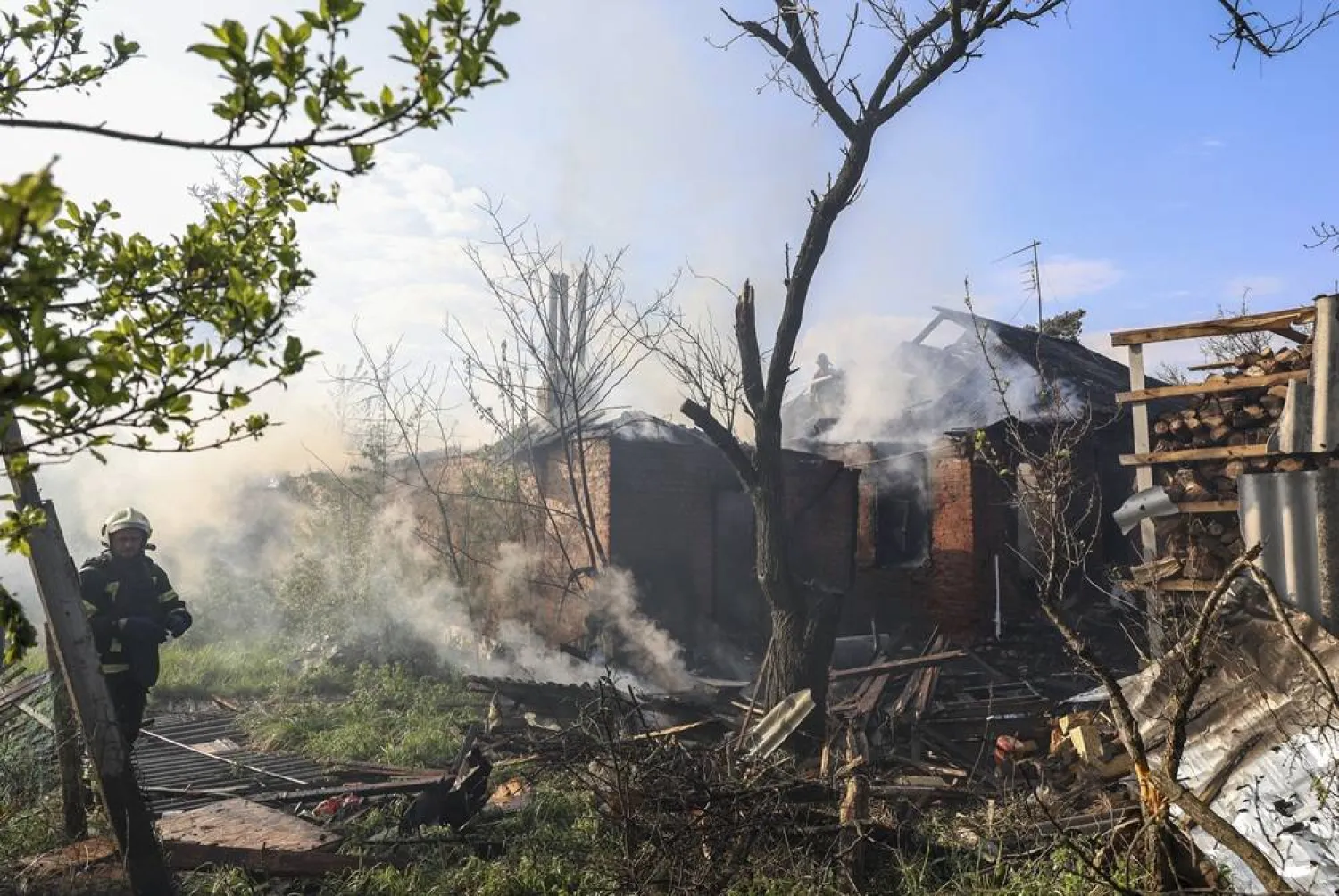 Ukrainian rescuers work at the site of a Russian strike on a private building in Kharkiv, northeastern Ukraine, 06 May 2026. (EPA)