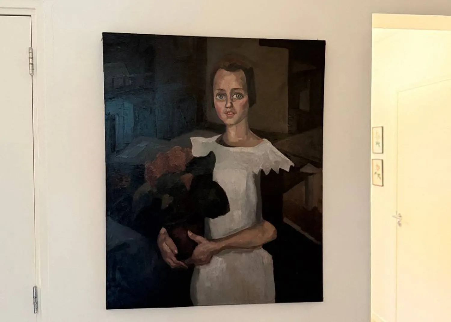 This handout photograph taken in an undisclosed area and released by Arthur Brand on May 11, 2026, shows the painting "Portrait of a Young Girl" by Dutch artist Toon Kelder, an art piece stolen from the world-famous Goudstikker collection by the Nazis, discovered in the house of the descendants of a notorious Dutch SS collaborator. (Handout and Arthur Brand / AFP)