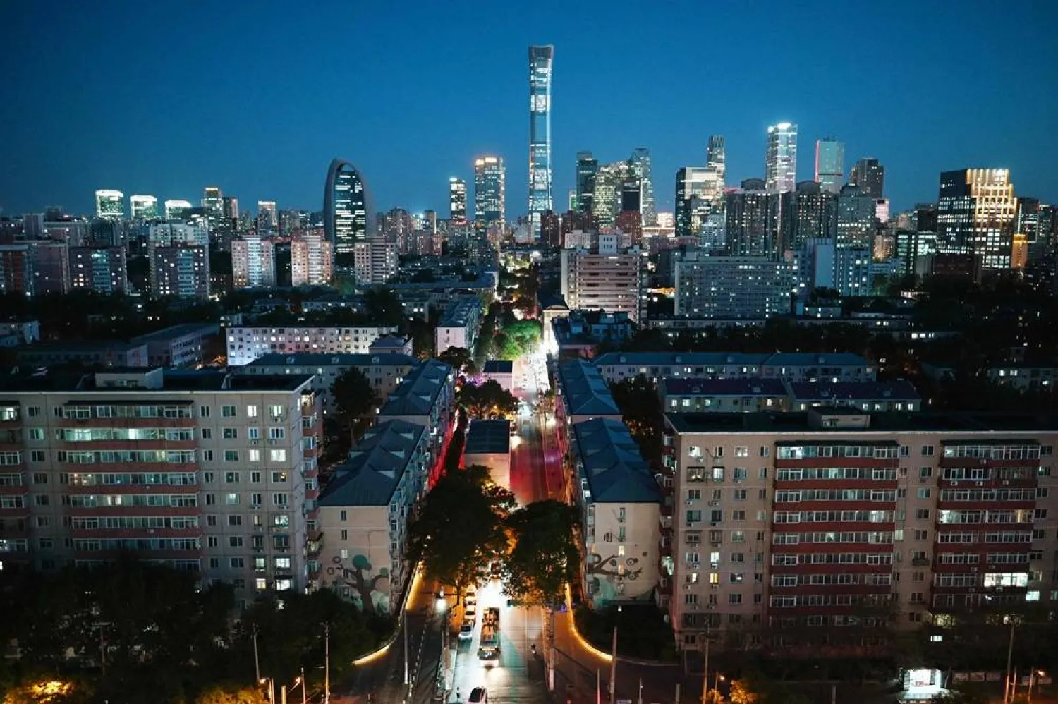  Buildings including China Zun, the tallest building in Beijing, are seen in the central business district in Beijing at dusk on May 7, 2026. (AFP) 