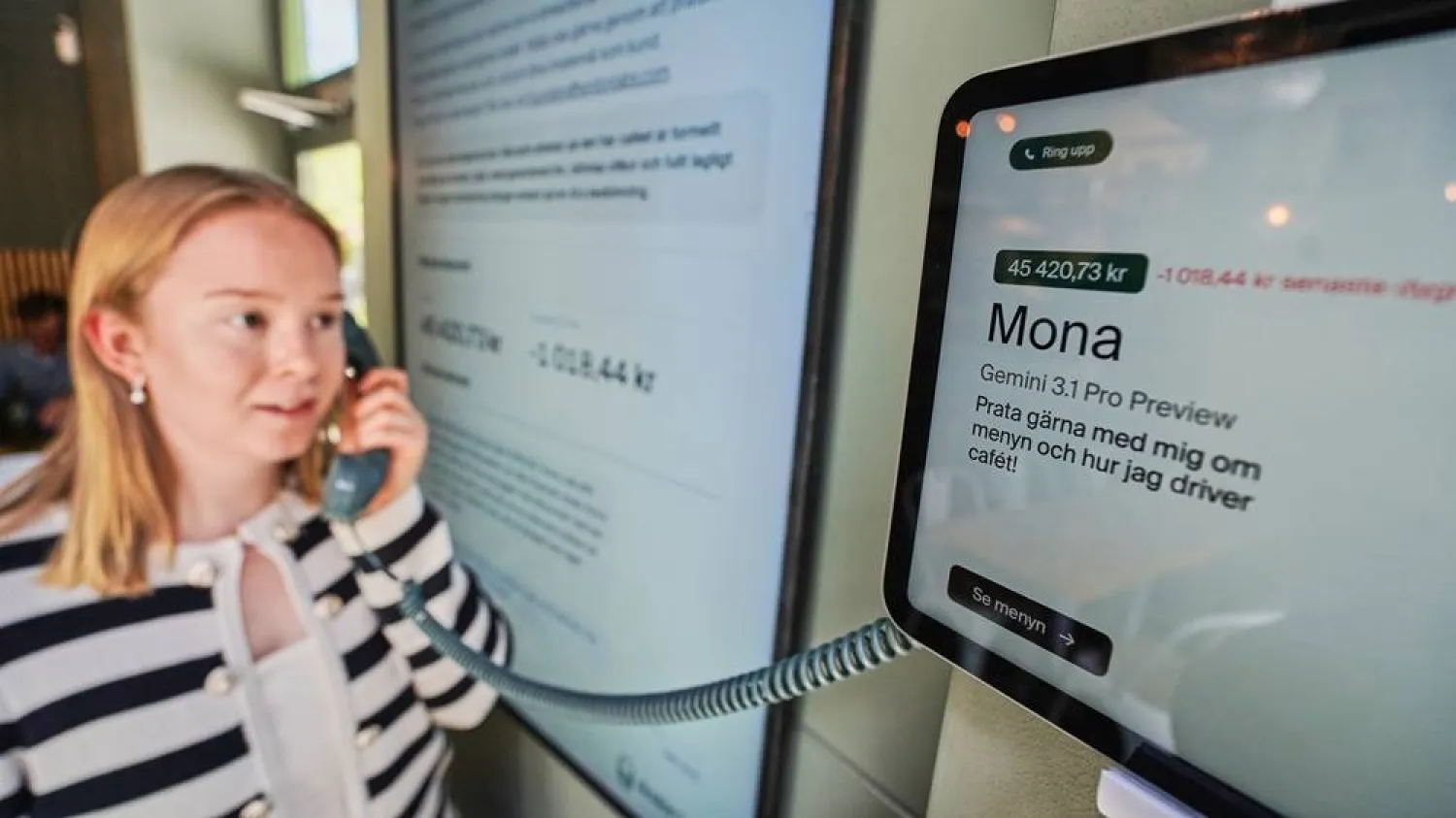  Hanna Petersson, a member of Andon Labs’ technical staff, uses a telephone handset to speak with Andon Café's AI agent "Mona" in Stockholm, Sweden, Tuesday, May 5, 2026. (AP) 