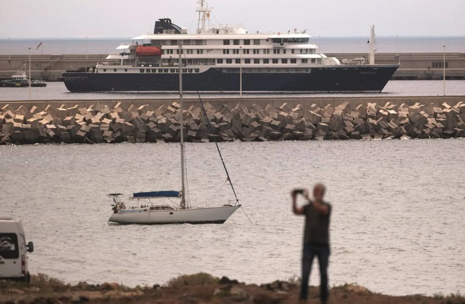  The hantavirus-stricken cruise ship MV Hondius is seen at anchor at the port of Granadilla in Tenerife, Canary Islands, Spain, Monday, May 11, 2026. (AP) 
