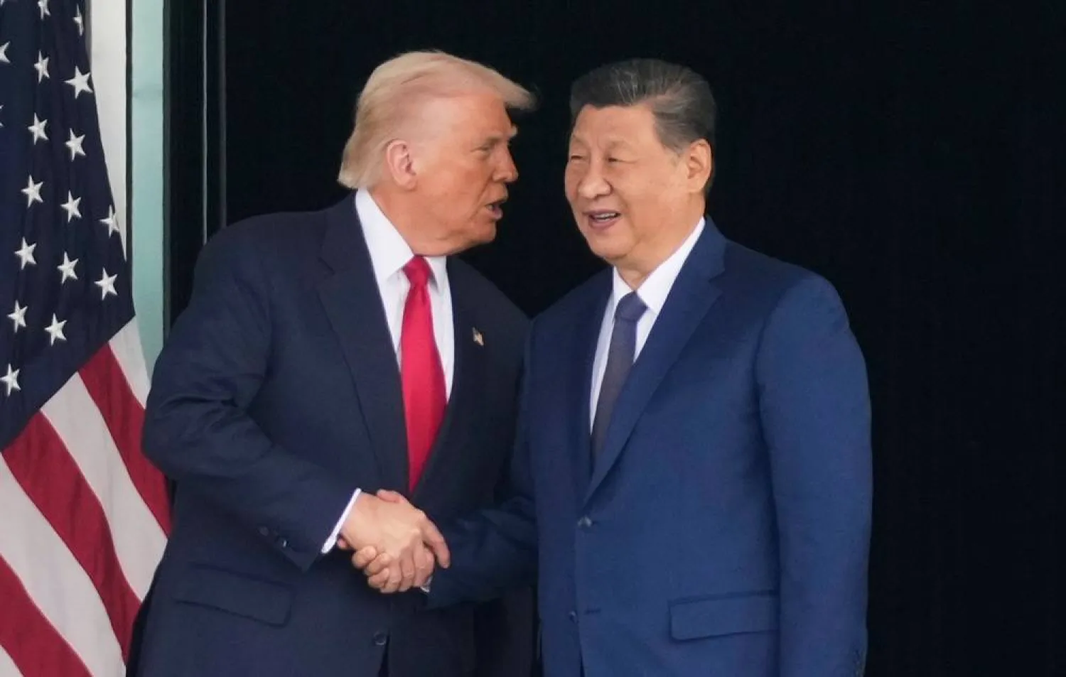 President Donald Trump, left, and Chinese President Xi Jinping, shake hands after their US-China summit talk at Gimhae International Airport Jinping in Busan, South Korea, Oct. 30, 2025. (AP)