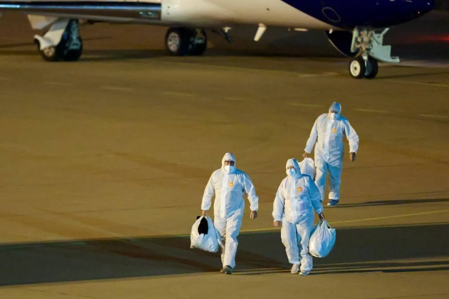 12 May 2026, Netherlands, Eindhoven: Crew members of the hantavirus-hit Hondius cruise ship arrive at Eindhoven airport. (dpa)