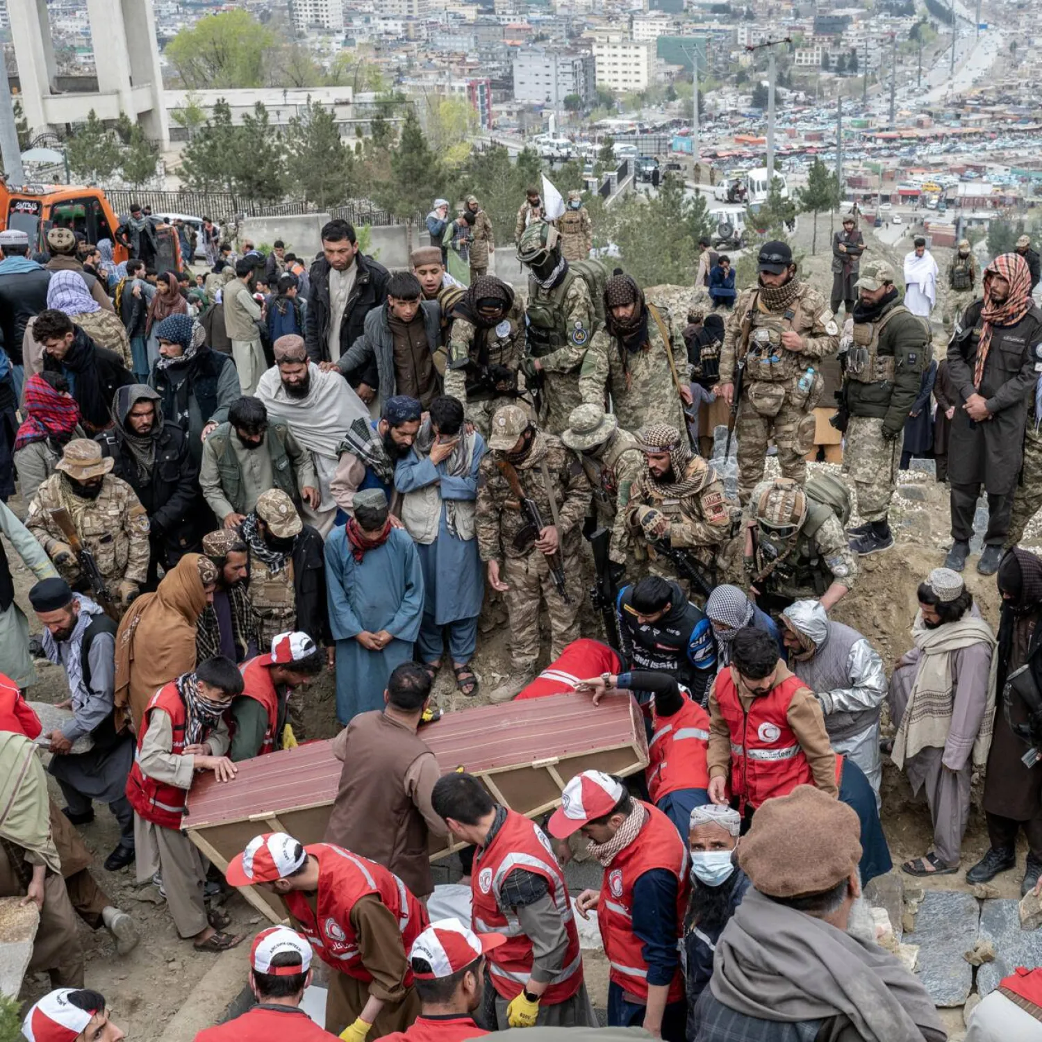 Victims of a strike on a drug rehab center in Kabul are burried in a mass grave on Badam Bagh Hilltop on March 26. Wakil KOHSAR / AFP/File