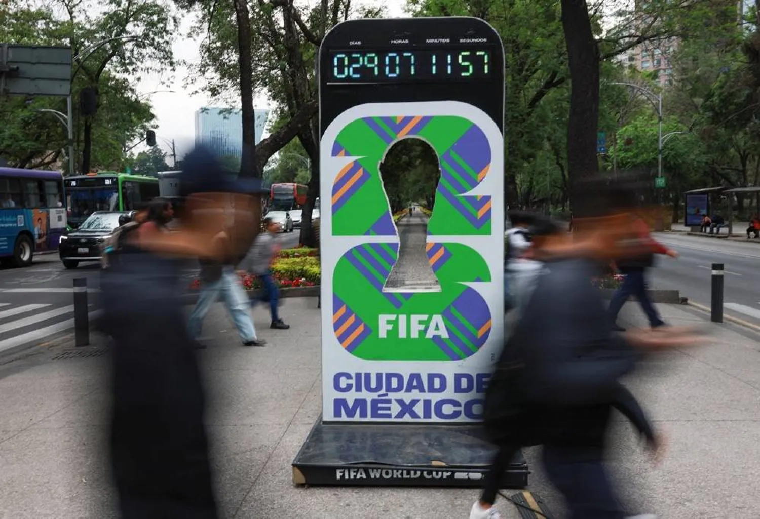  People walk past a sign that counts down the time until the tournament kicks off, ahead of the World Cup starting on June 11, in Mexico City, Mexico, May 11, 2026. (Reuters)