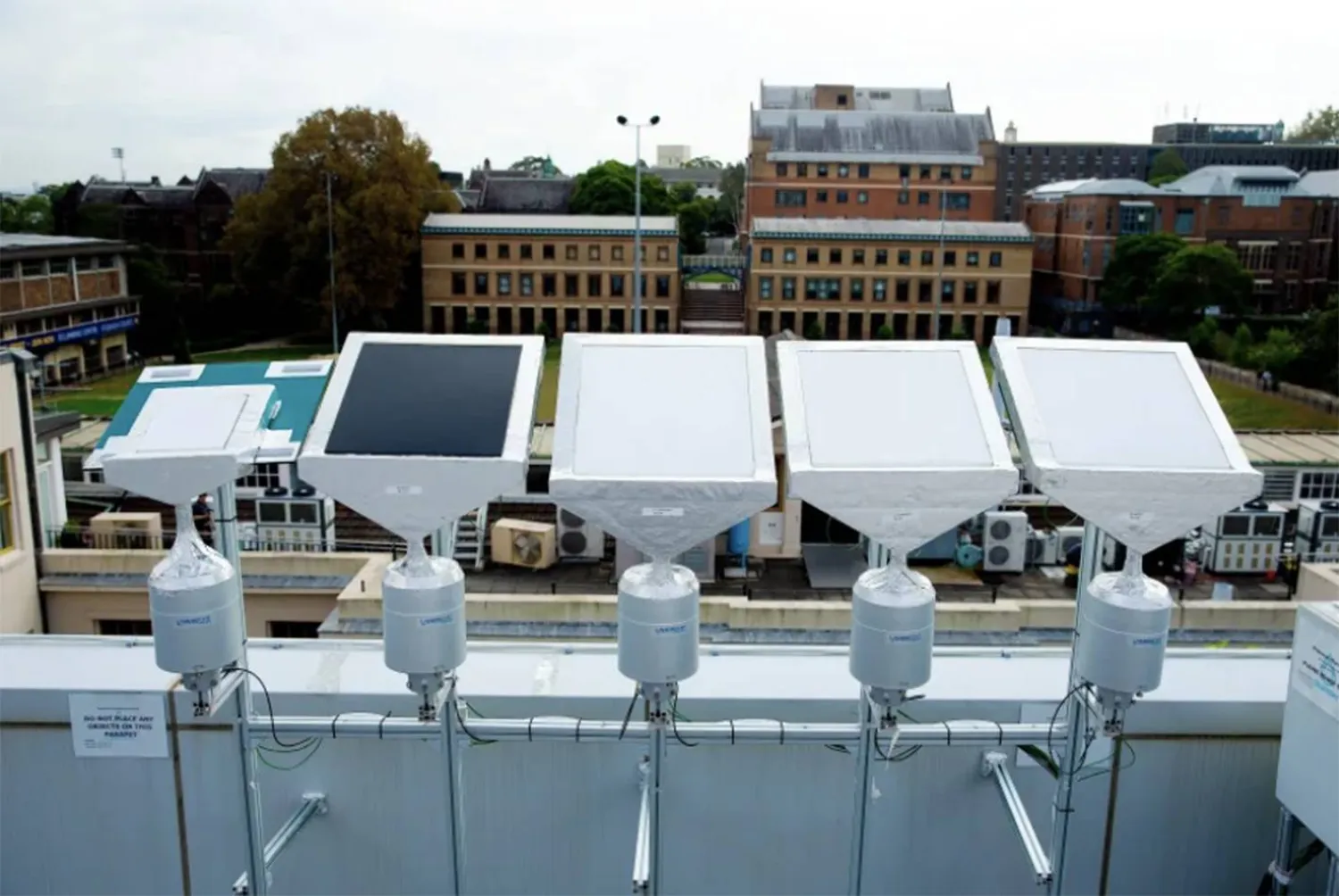 The researchers tested four painted panels in black and white over three months, tracking temperature, atmospheric conditions, and other variables on a University of Syndey rooftop (Dewpoint Innovations)