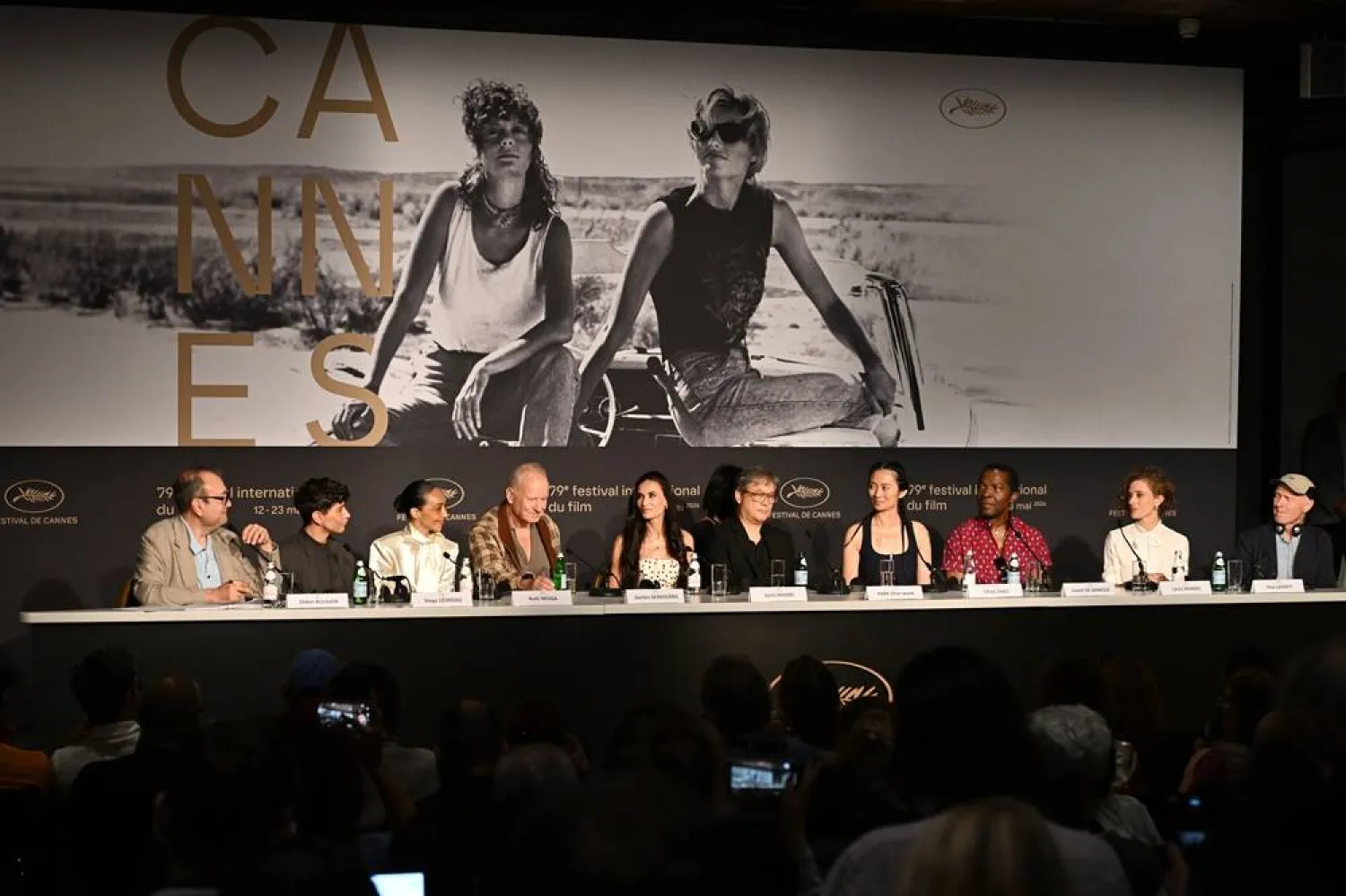 (L-R) Host Didier Allouch, Jury Members Diego Cespedes, Ruth Negga, Stellan Skarsgard, Demi Moore, Jury President Park Chan-wook, Chloe Zhao, Isaach de Bankole, Laura Wandel and Paul Laverty attend the press conference for Feature Films Jury during the 79th annual Cannes Film Festival, in Cannes, France, 12 May 2026. (EPA)