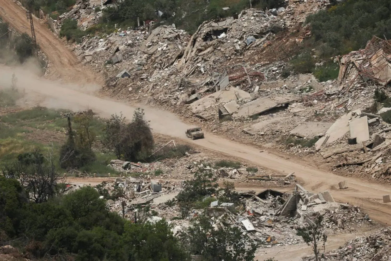 An Israeli military vehicle moves inside Lebanese territory (Reuters)