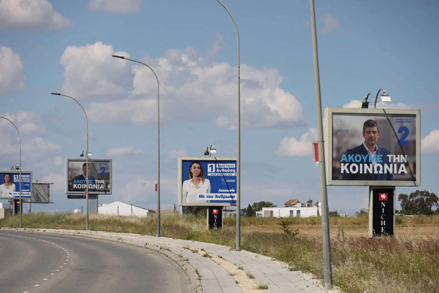 Election campaign billboards of candidates for Cyprus parliamentary election, to be held on May 24, are placed on a street in Nicosia, Cyprus May 6, 2026. REUTERS/Yiannis Kourtoglou