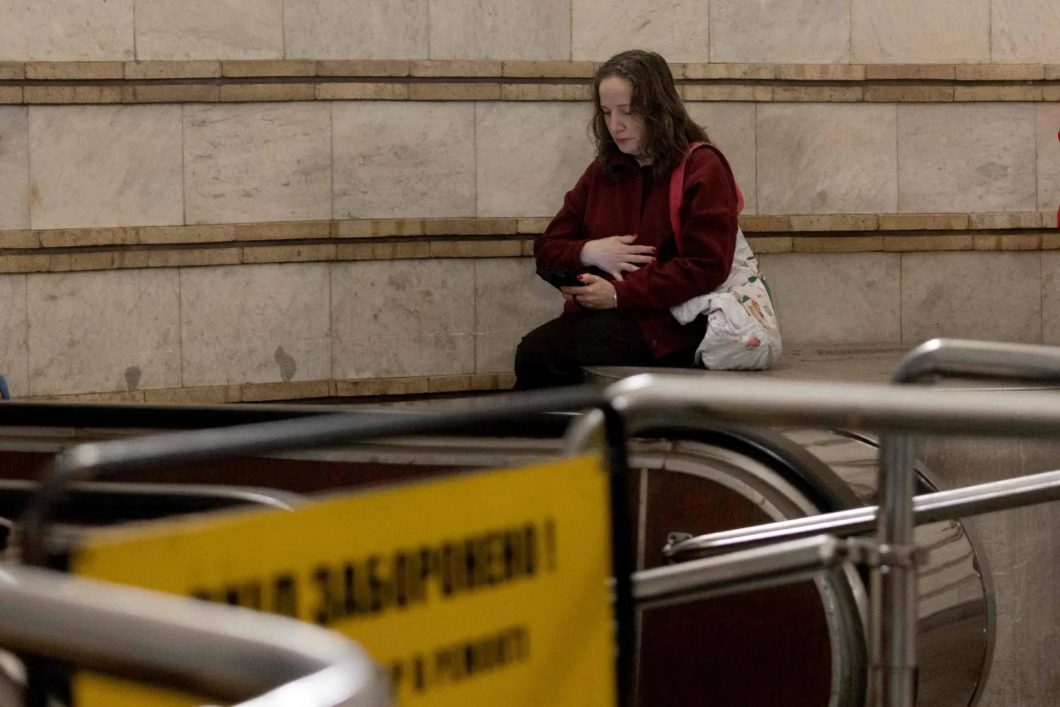  A local resident waits for the end of an air alarm at one of the subway stations in Kyiv on May 13, 2026, amid the Russian invasion of Ukraine. (AFP) 