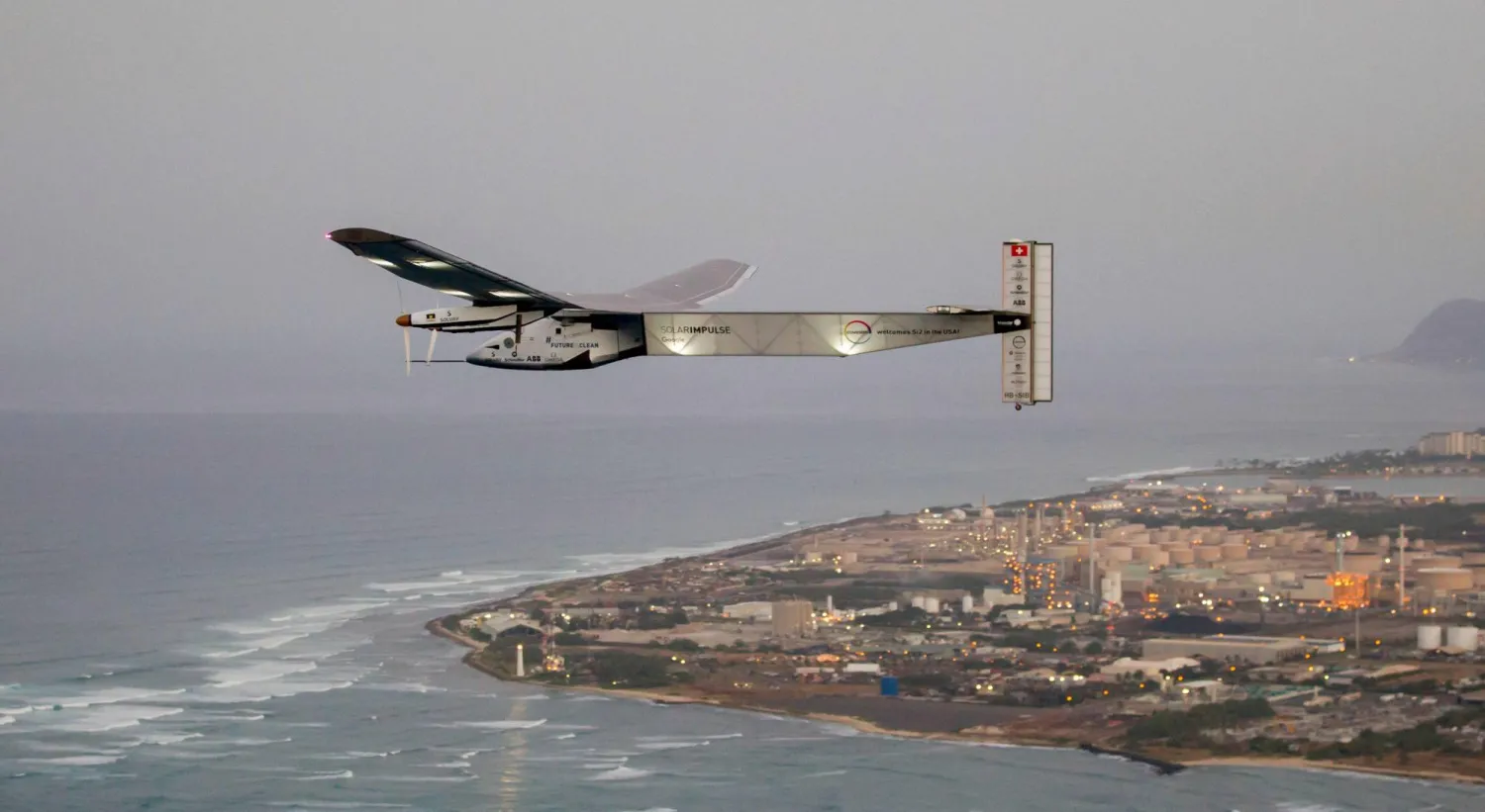 (FILES) The Solar Impulse 2 solar powered airplane flies off Kapolei, Hawaii, on March 3, 2016 on a all-day test flight. (Photo by Eugene TANNER / AFP)