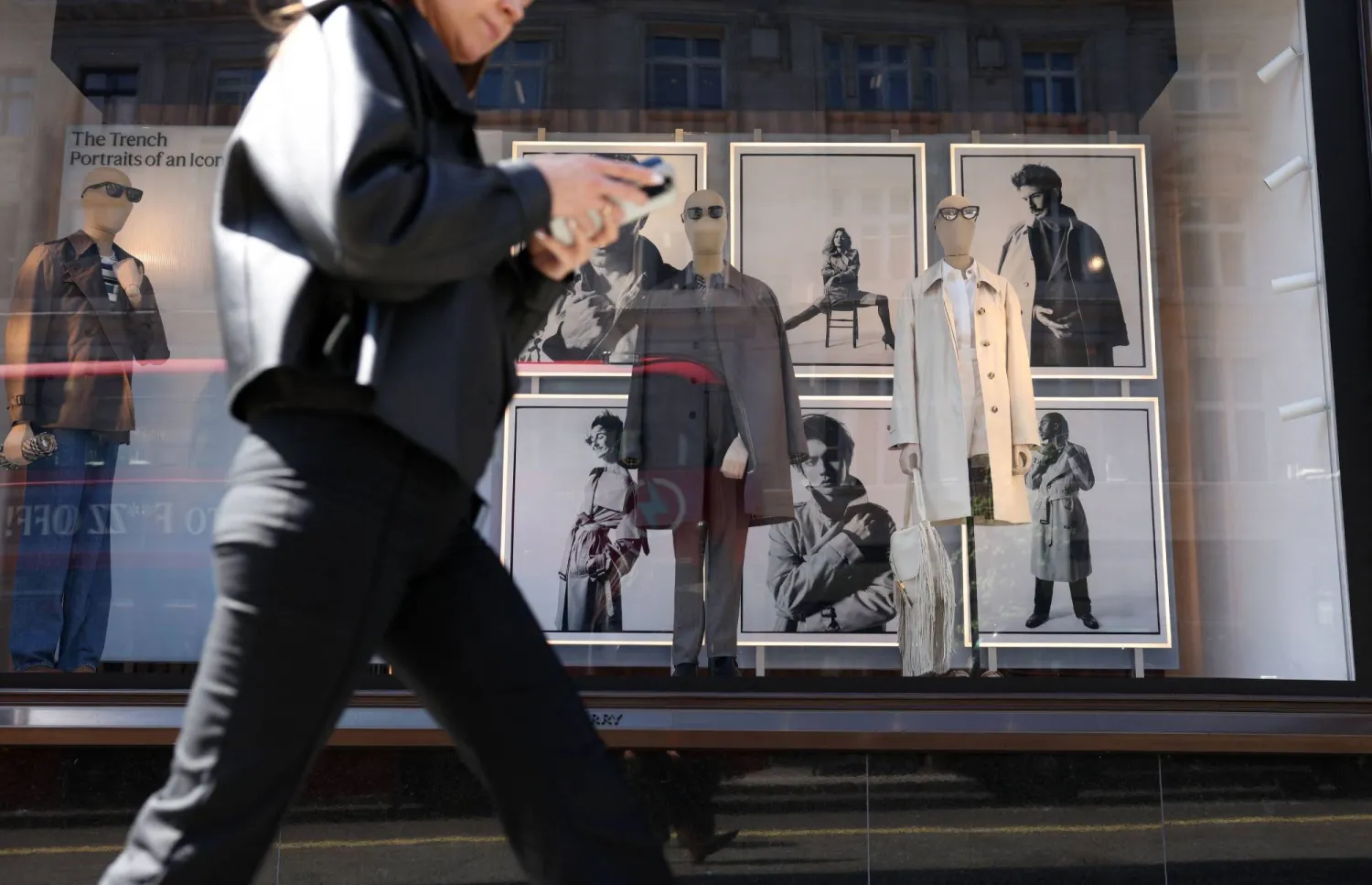 People walk past the Burberry store on Regent Street in central London on May 12, 2026. (Photo by Adrian DENNIS / AFP)