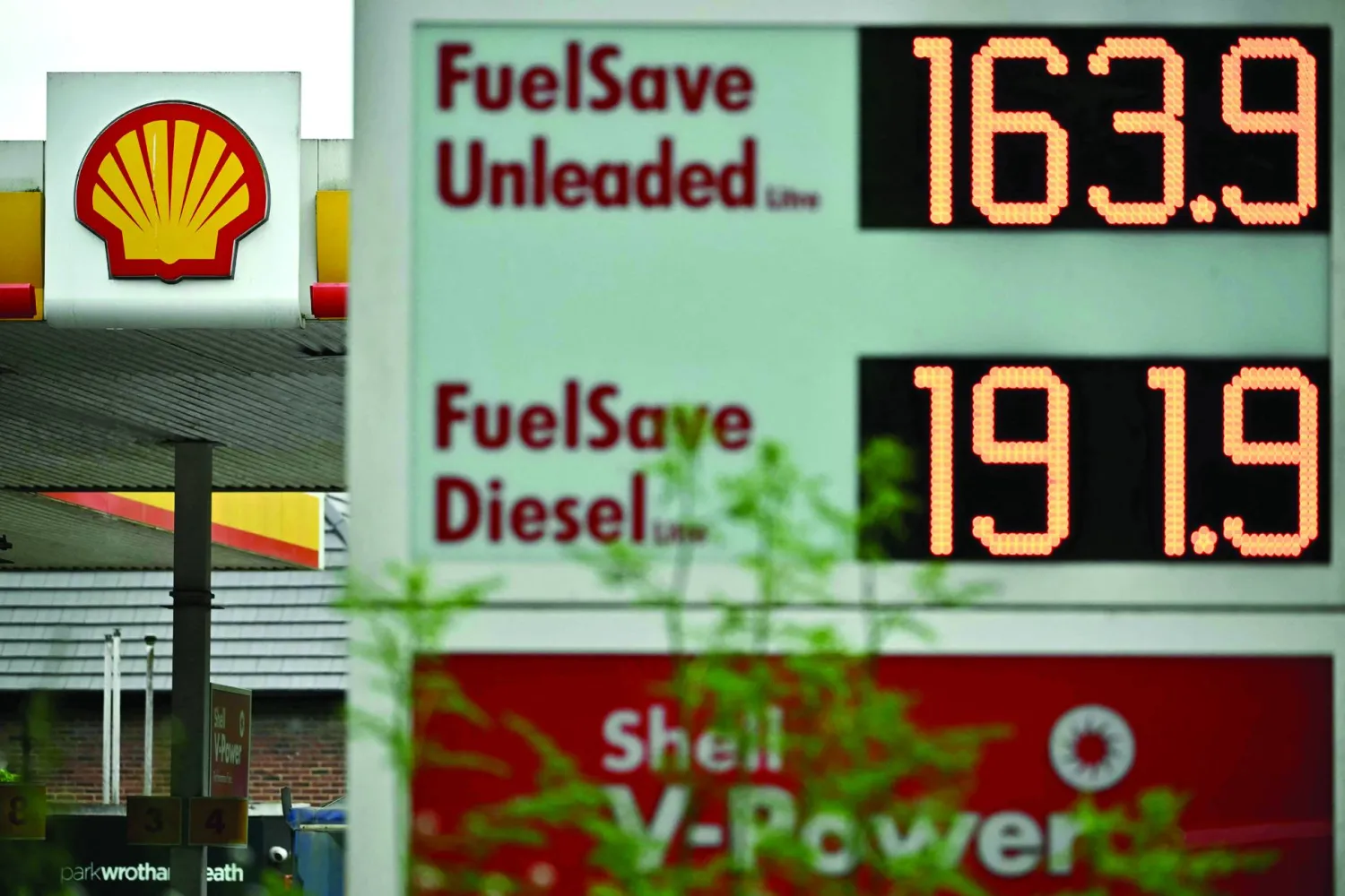 (FILES) The price per litre of unleaded petrol and diesel is pictured in front a Shell petrol station in Wrotham Heath, south east England on May 7, 2026. British energy giant Shell announced on May 7, 2026 a 19-percent increase in net profits for the first quarter as the Middle East war sent oil and gas prices soaring in volatile trading. (Photo by Ben STANSALL / AFP)