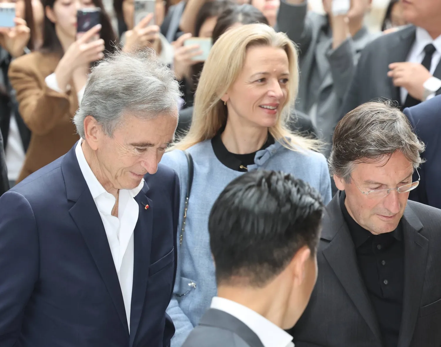 Bernard Arnault (L), chair of the world's largest luxury house LVMH, and Delphine Arnault (C), his daughter and CEO of Christian Dior Couture, arrive at Shinsegae Inc.'s flagship department store in Seoul, South Korea, 11 May 2026, to visit The Louis Vuitton Visionary Journeys Seoul.  EPA/YONHAP