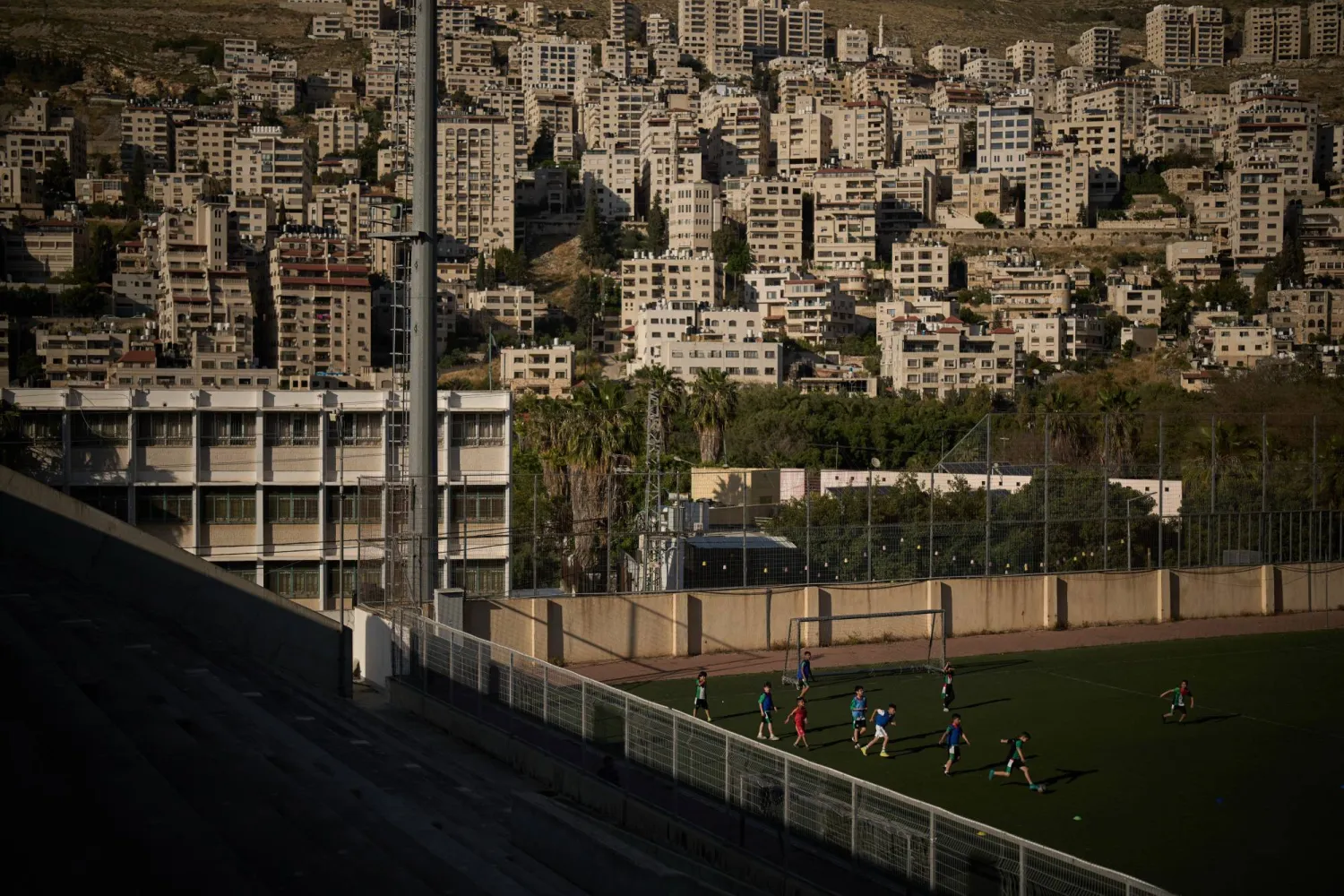 Palestinian boys from a local soccer academy run after the ball during a training session at the municipal stadium of the West Bank City of Nablus, Thursday, May 7, 2026. (AP Photo/Leo Correa)