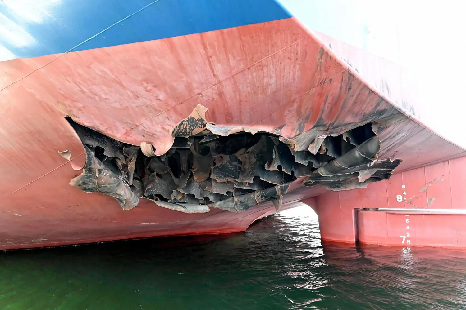  This undated handout photograph released by South Korea's Foreign Ministry on May 10, 2026, shows a damaged part of the South Korean cargo ship HMM Namu docked at a port in Dubai. (Handout / South Korean Foreign Ministry / AFP) 
