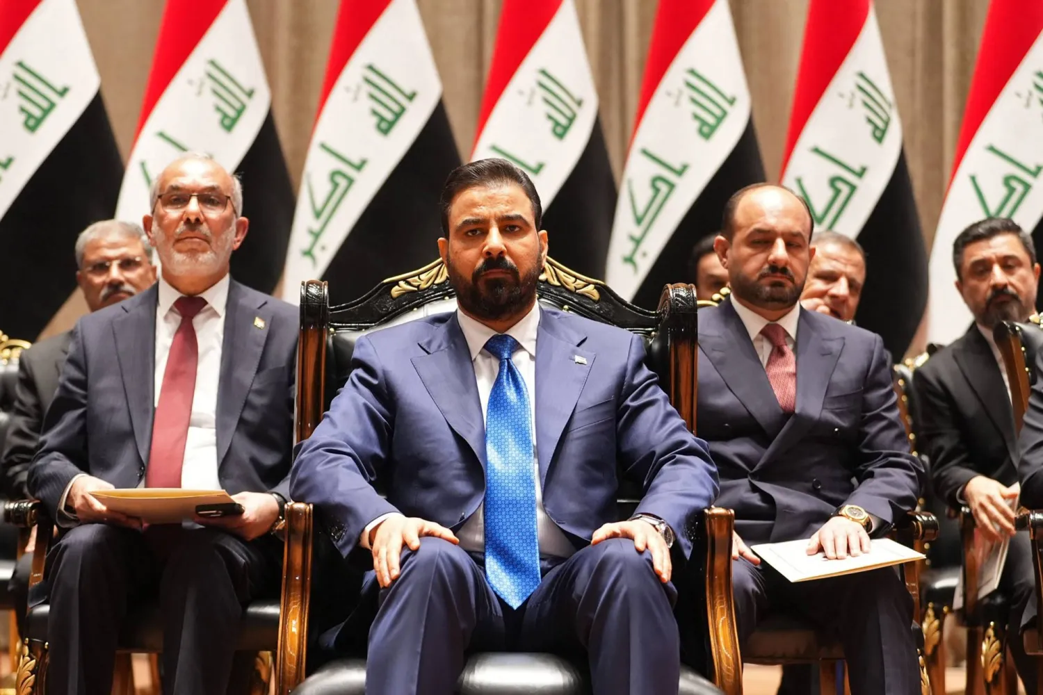 This handout picture released by the Iraqi Prime Minister's Press Office shows new prime minister-designate Ali al-Zaidi (C) sitting ahead of presenting his government to the parliament in Baghdad on May 14, 2026. (Iraqi Prime Minister’s Press Office / AFP)