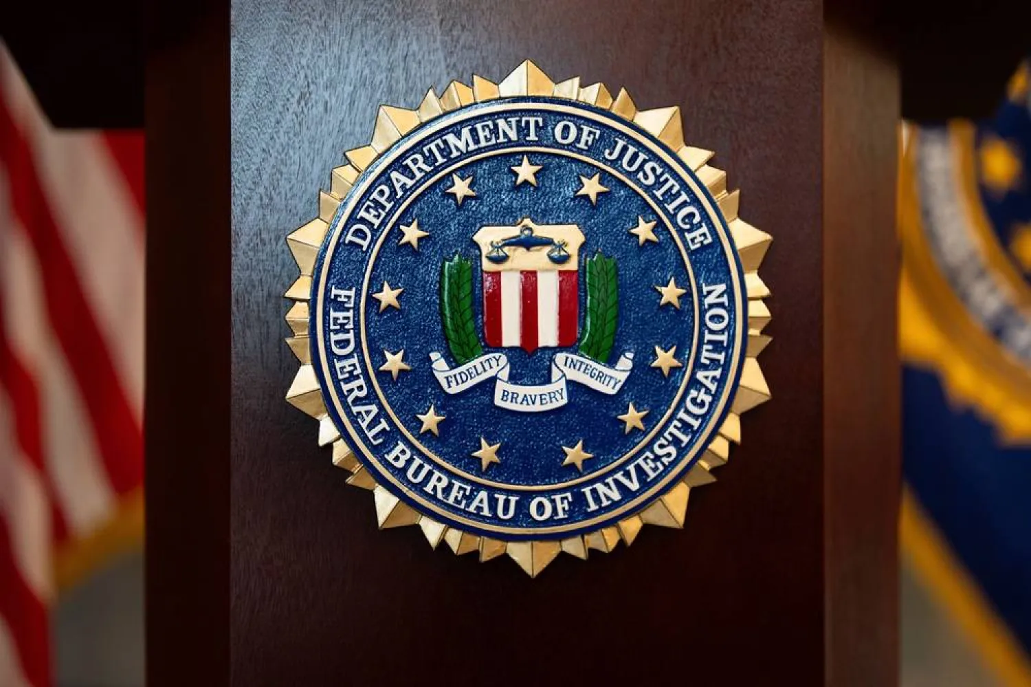 An FBI seal is displayed on a podium before a news conference at the field office in Portland, Ore., Jan. 16, 2025. (AP)