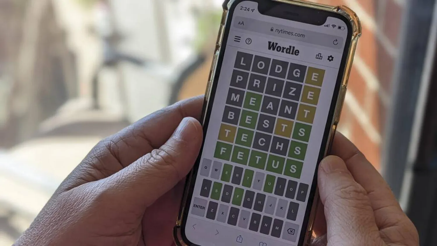 This photo illustration shows a person playing online word game Wordle on a mobile phone. Michael Draper / AFP/File
