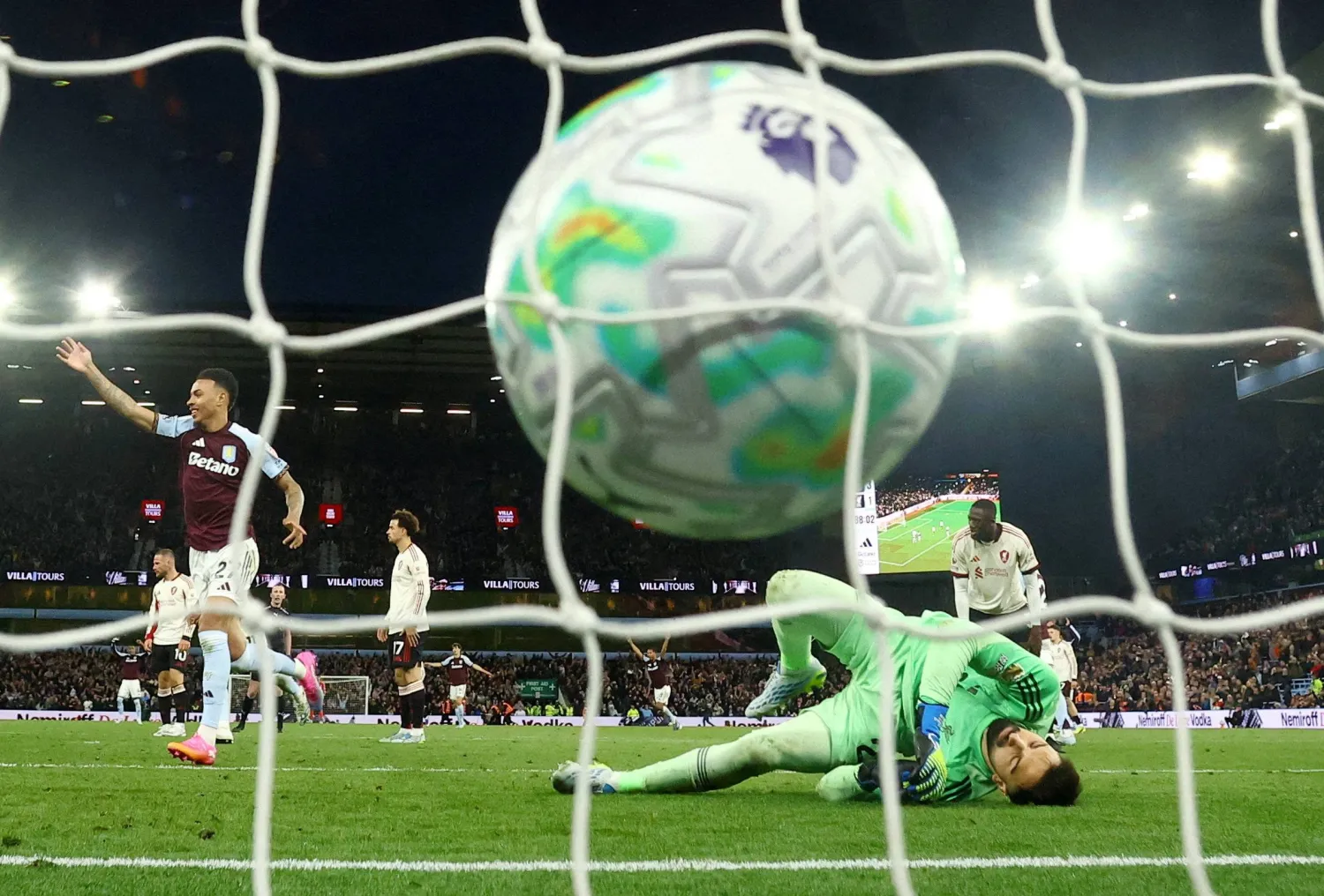 Football - Premier League - Aston Villa v Liverpool - Villa Park, Birmingham, Britain - May 15, 2026 Aston Villa's John McGinn scores their fourth goal past Liverpool's Giorgi Mamardashvili. (Action Images via Reuters/Andrew Boyers)