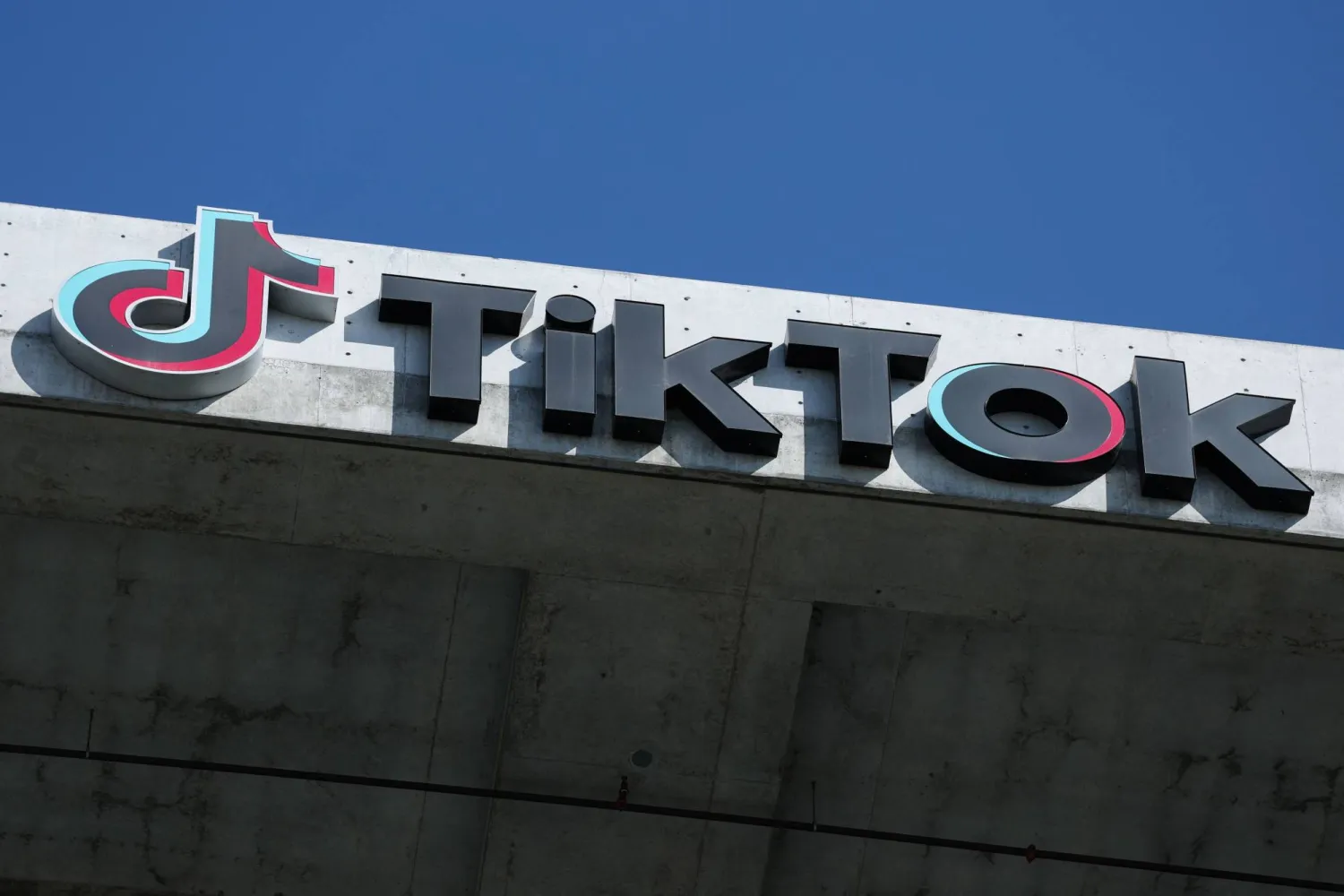 The TikTok logo is displayed on signage outside TikTok social media app company offices in Culver City, California on September 30, 2025. (AFP)