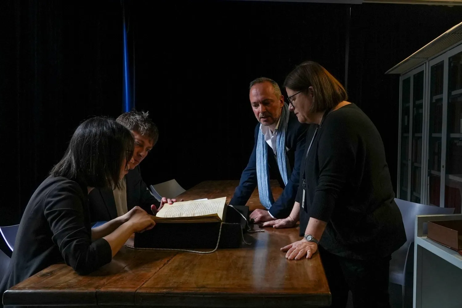 From left, Elisabetta Magnanti, Mark Faulkner of Dublin's Trinity College, Andrea Cappa and Valentina Longo of Rome's National Central Library examine a manuscript containing a rare, long-lost copy of Caedmon's Hymn — the first poem ever written down in Old English — at Rome's National Library, Thursday, May 8, 2026. (AP Photo/Andrea Rosa)