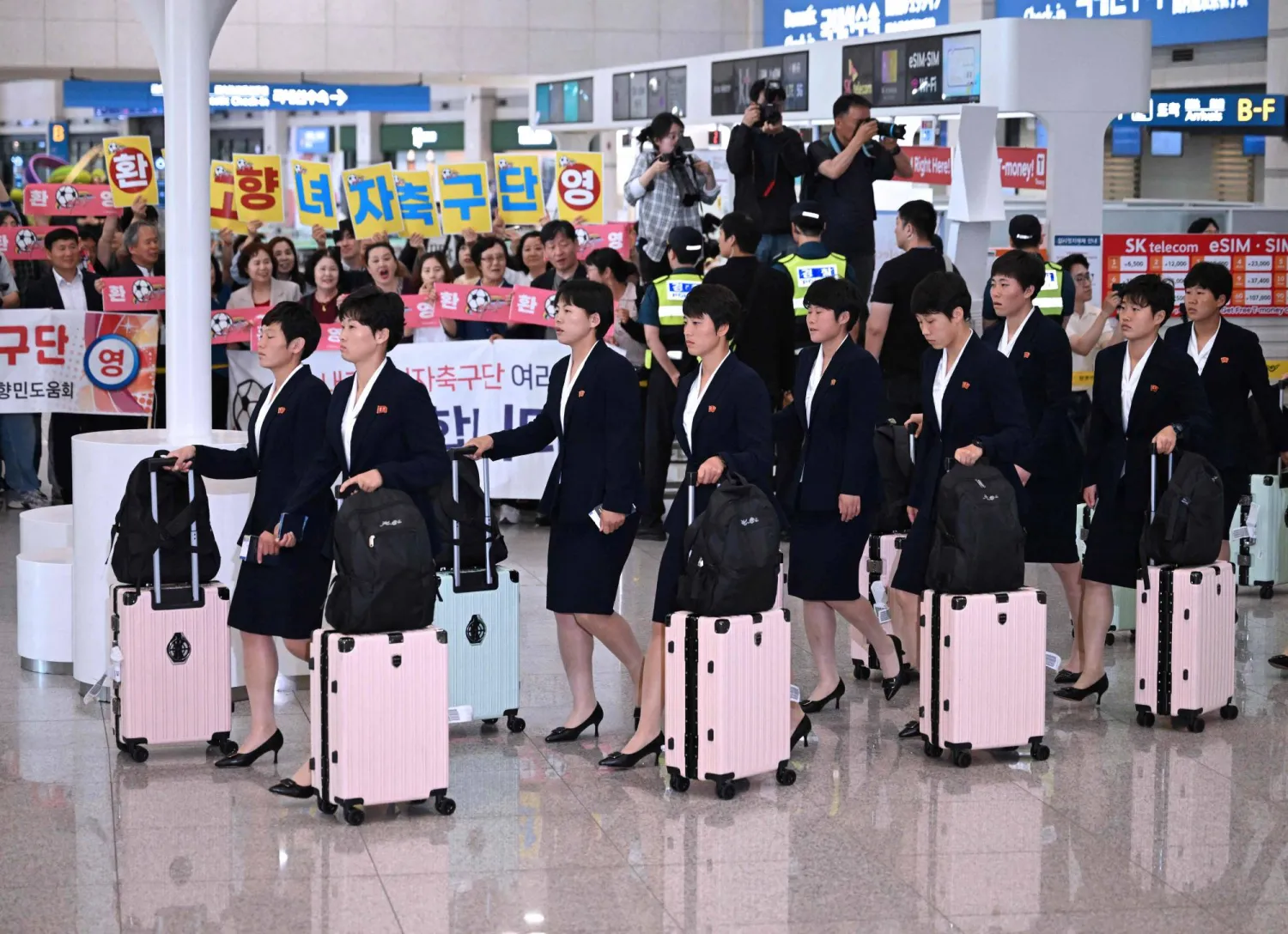 North Korea's Naegohyang Women's FC players arrive at Incheon International Airport in Incheon on May 17, 2026, ahead of the Women's Asian Champions League semi-final football match against South Korea's Suwon FC Women. (Photo by Jung Yeon-je / AFP)