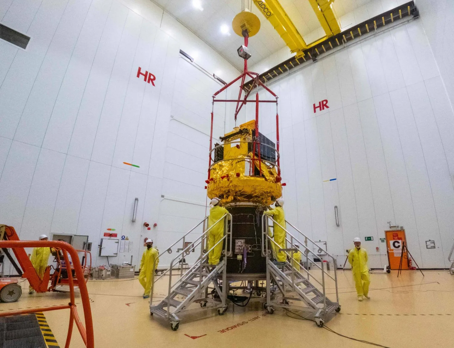 This photograph shows the Smile spacecraft (gold) fixed to a Vega-C rocket adaptor (black cone) on 25 March 2026, in Kourou, French Guiana, in preparation for liftoff from Europe's Spaceport. (Photo by ESA / AFP)