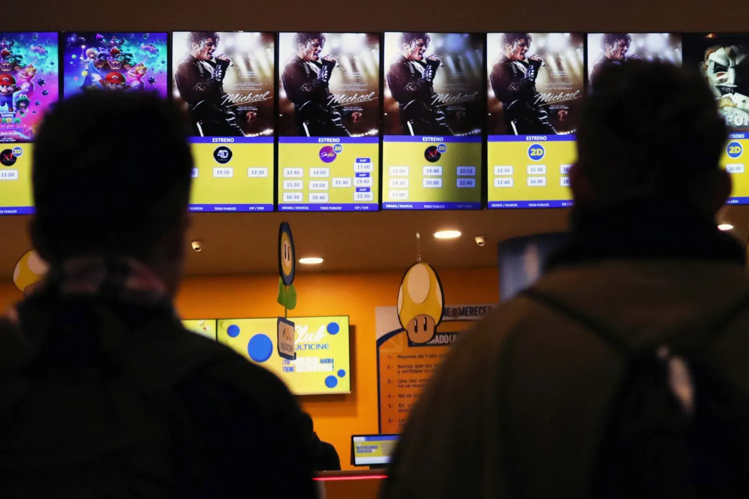 People observe the ‘Michael’ movie poster at a multiplex theater in La Paz, Bolivia, 23 April 2026.  EPA/LUIS GANDARILLAS