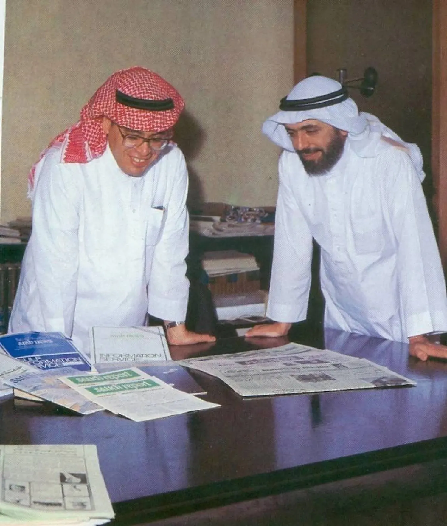 Publishers Hisham and Mohamed Ali Hafez look through publications. 