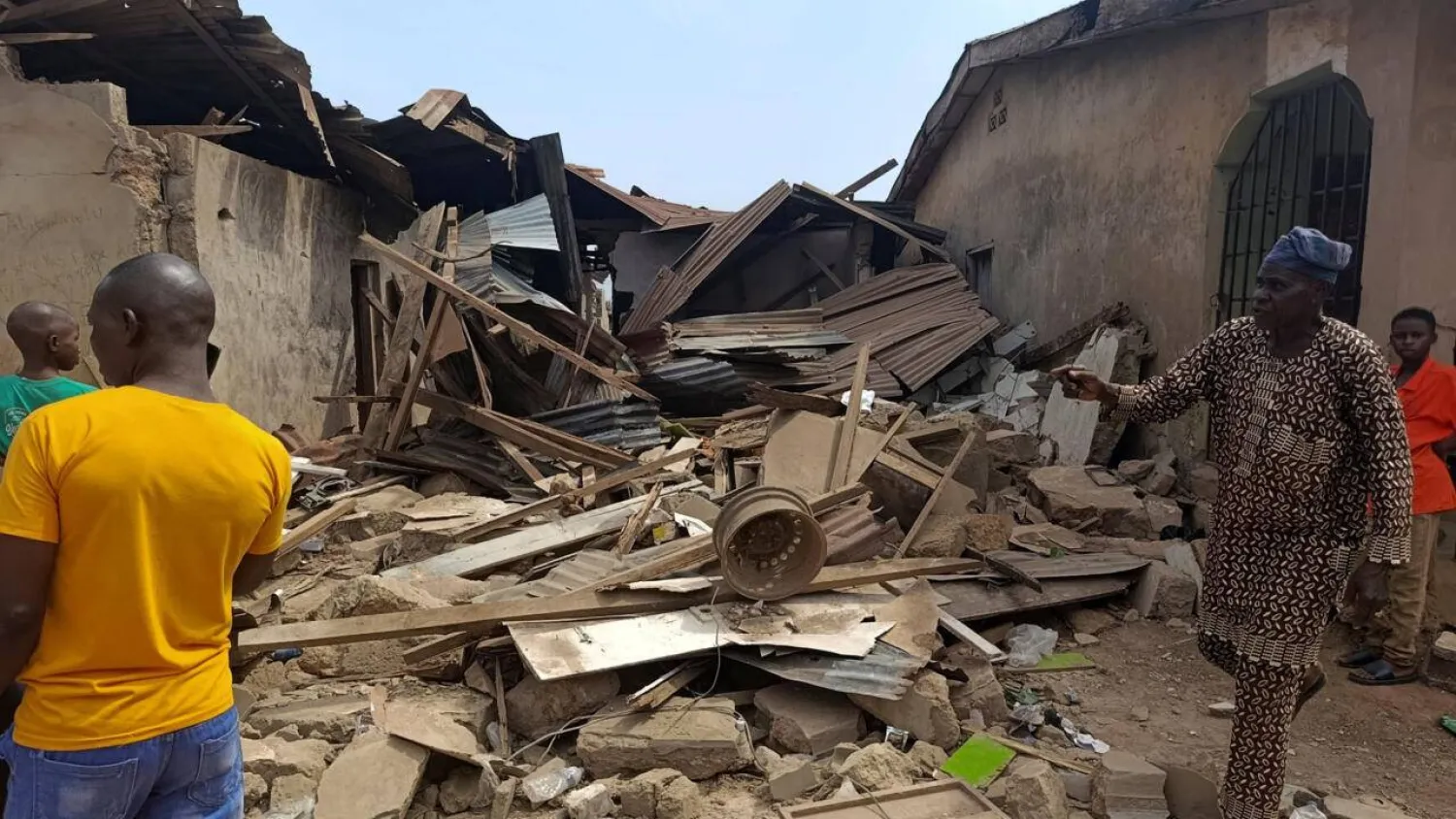 Residents inspect the damage after US forces launched a strike against ISIS group militants in Nigeria at the request of Nigeria's government. Abdullahi Dare Akogu, Reuters
