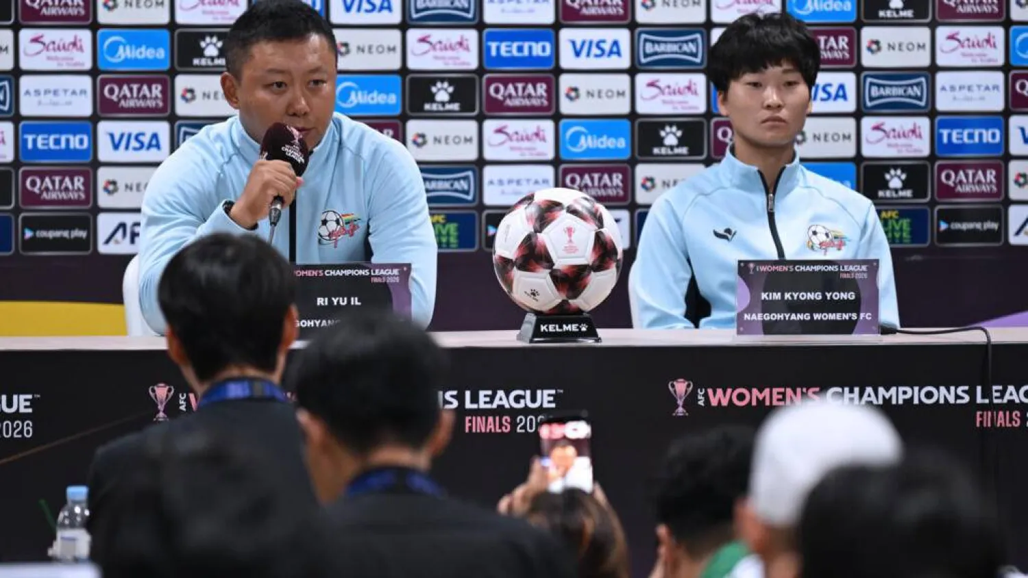 North Korea's Naegohyang Women's FC head coach Ri Yu Il (L) and captain Kim Kyong Yong (R) attend a press conference at Suwon Sports Complex ahead of the Women's Asian Champions League semi-final. JUNG YEON-JE / POOL/AFP
