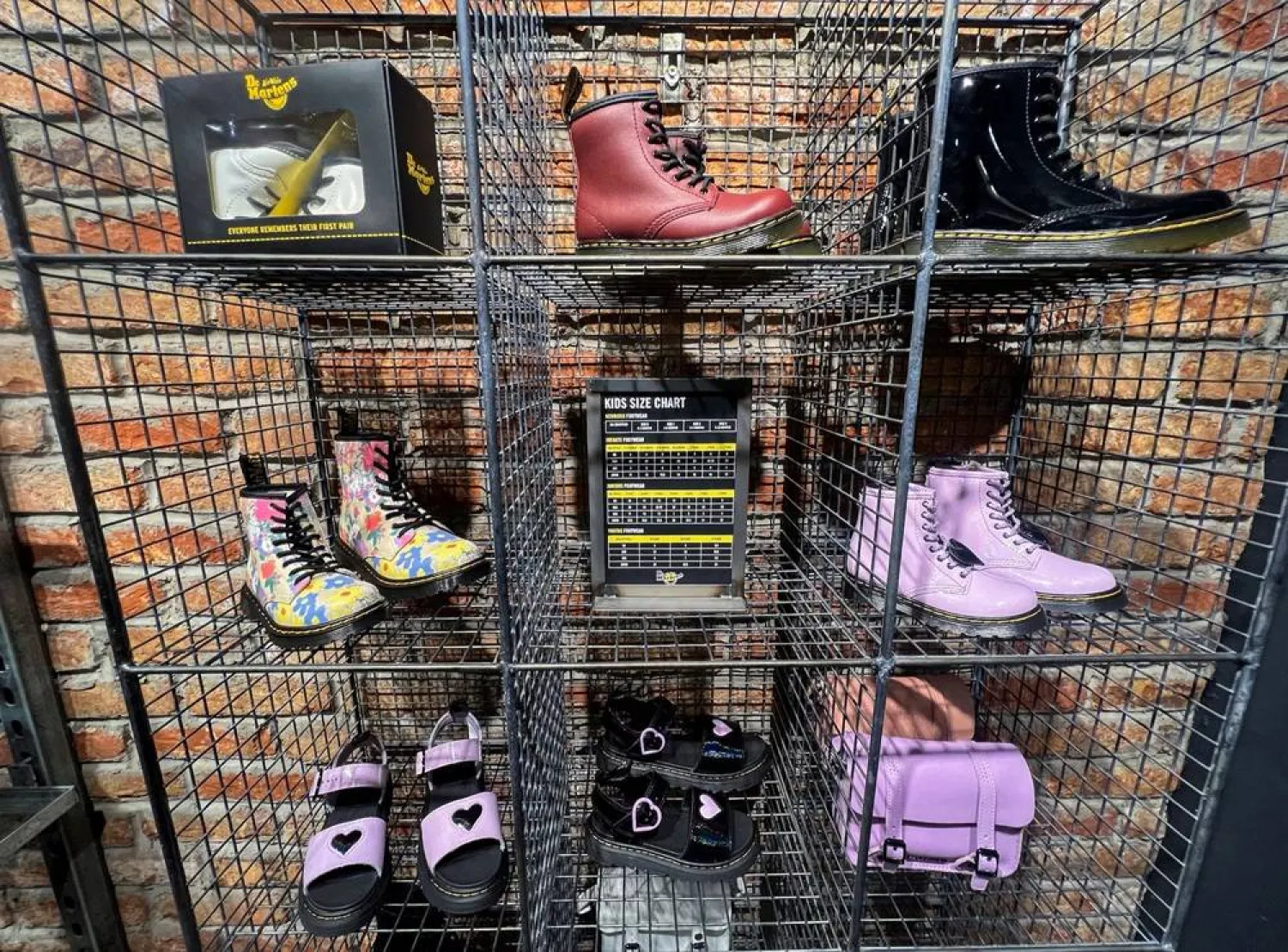 Dr. Martens shoes are displayed inside a shop in Manchester, Britain, May 26, 2023. (Reuters) 