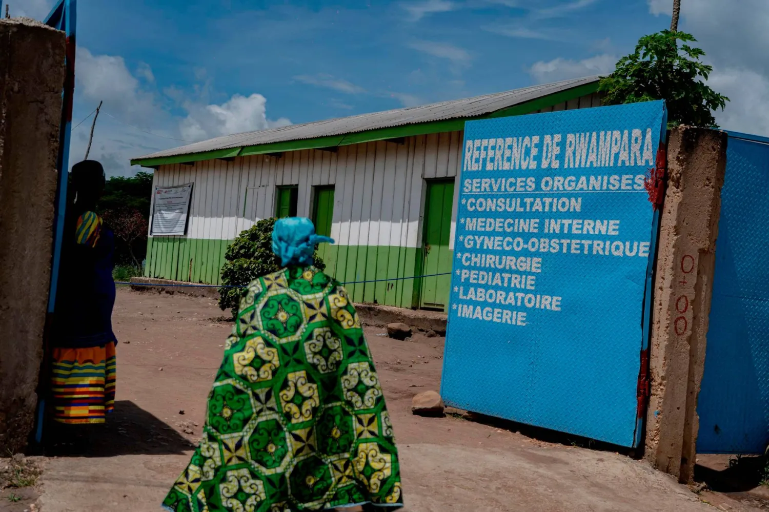 A visitor walks at the entrance of a hospital in Rwampara on May 19, 2026. (AFP) 