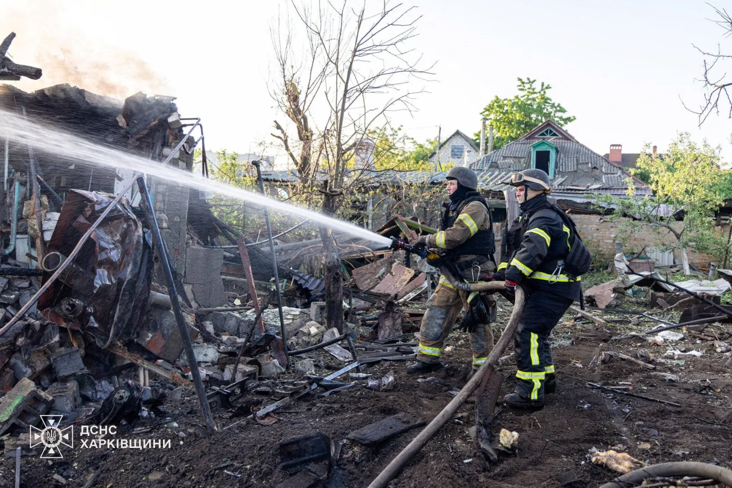 Firefighters work at the site of private houses damaged during morning Russian drone strikes, amid Russia's attack on Ukraine, Kharkiv, Ukraine May 19, 2026. Press service of the State Emergency Service of Ukraine/Handout via REUTERS 