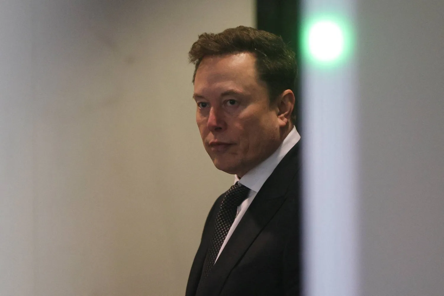 FILE PHOTO: Elon Musk walks to attend the trial in his lawsuit over OpenAI for-profit conversion at a federal courthouse, in Oakland, California, US, April 29, 2026. REUTERS/Manuel Orbegozo/File Photo