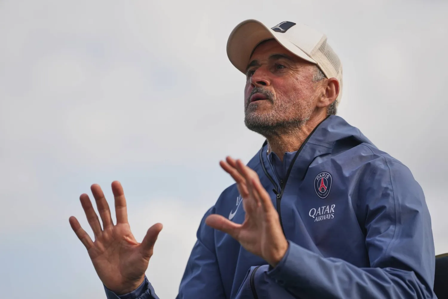 PSG's head coach Luis Enrique talks to his squad during a training session at the Paris Saint-Germain training center Wednesday May 20, 2026, in Poissy, west of Paris, ahead of the Champions League final against Arsenal in Budapest on May 30. (AP Photo/Thibault Camus)