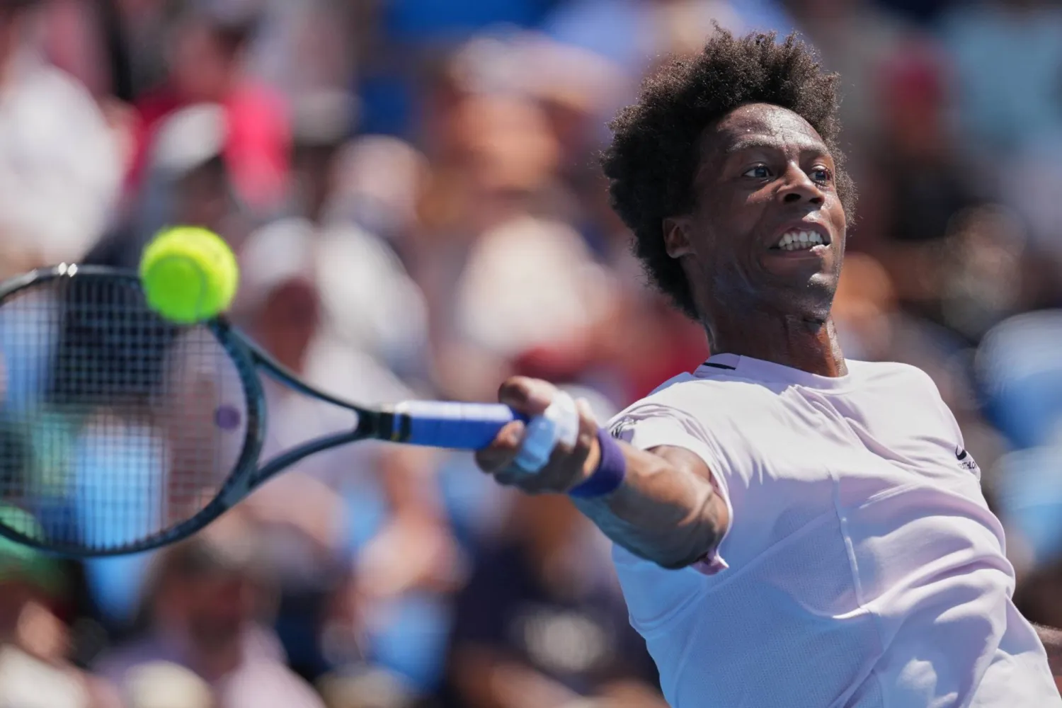 FILE - Gael Monfils of France plays a forehand return to Dane Sweeny of Australia during their first round match at the Australian Open tennis championship in Melbourne, Australia, Jan. 20, 2026. (AP Photo/Dita Alangkara, File)