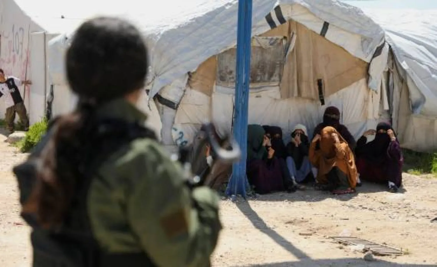 Members of Australian families believed to be linked to the ISIS militants wait to leave Roj camp near Derik, Syria April 24, 2026. REUTERS/Orhan Qereman/File Photo 