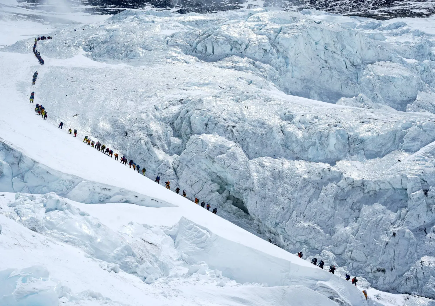 Climbers walk in a long queue as they head to summit Mount Everest in the Solukhumbu district, also known as the Everest region, Nepal, May 18, 2026. REUTERS/Purnima Shrestha