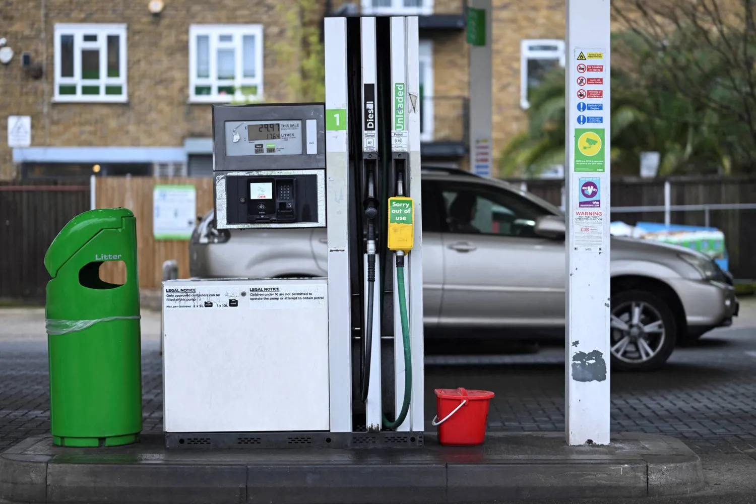 FILE PHOTO: An out of use sign hangs from a nozzle of an unleaded petrol pump on the forecourt of an Asda petrol station in Bethnal Green, London, Britain, March 27, 2026 REUTERS/Jaimi Joy/File Photo