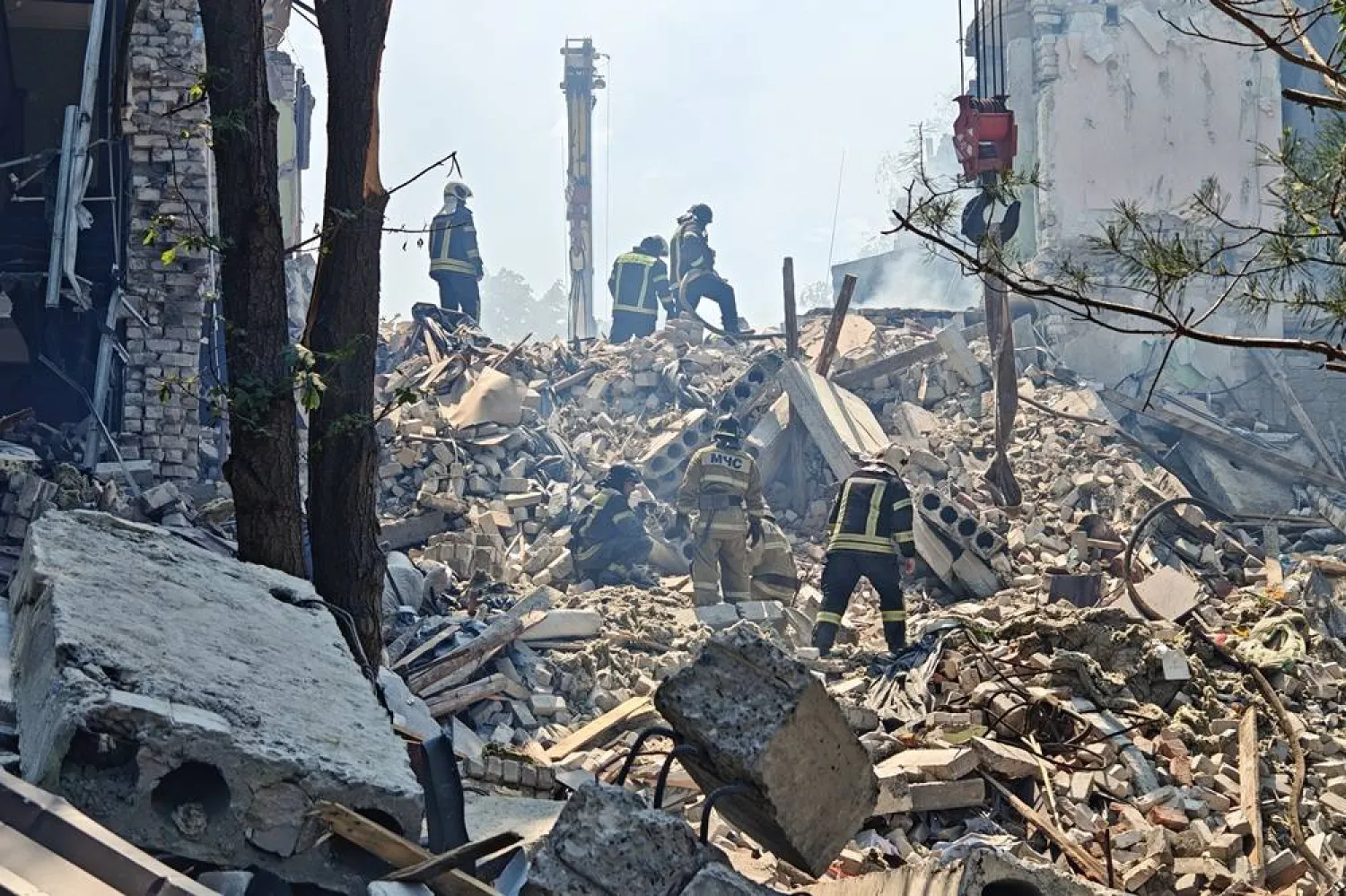 22 May 2026, Ukraine, Starobelsk: Emergency workers search through the rubble of the dormitory of the Starobelsk Professional College, part of the Lugansk State Pedagogical University, which was hit and destroyed in a Ukrainian drone strike on Starobelsk. (Alexander Reka/TASS via ZUMA Press/dpa) 