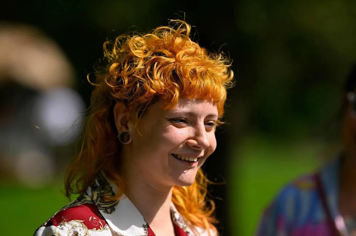 A woman attends the annual European Mullet Cup in Audregnies, southern Belgium, on May 23, 2026. (AFP)