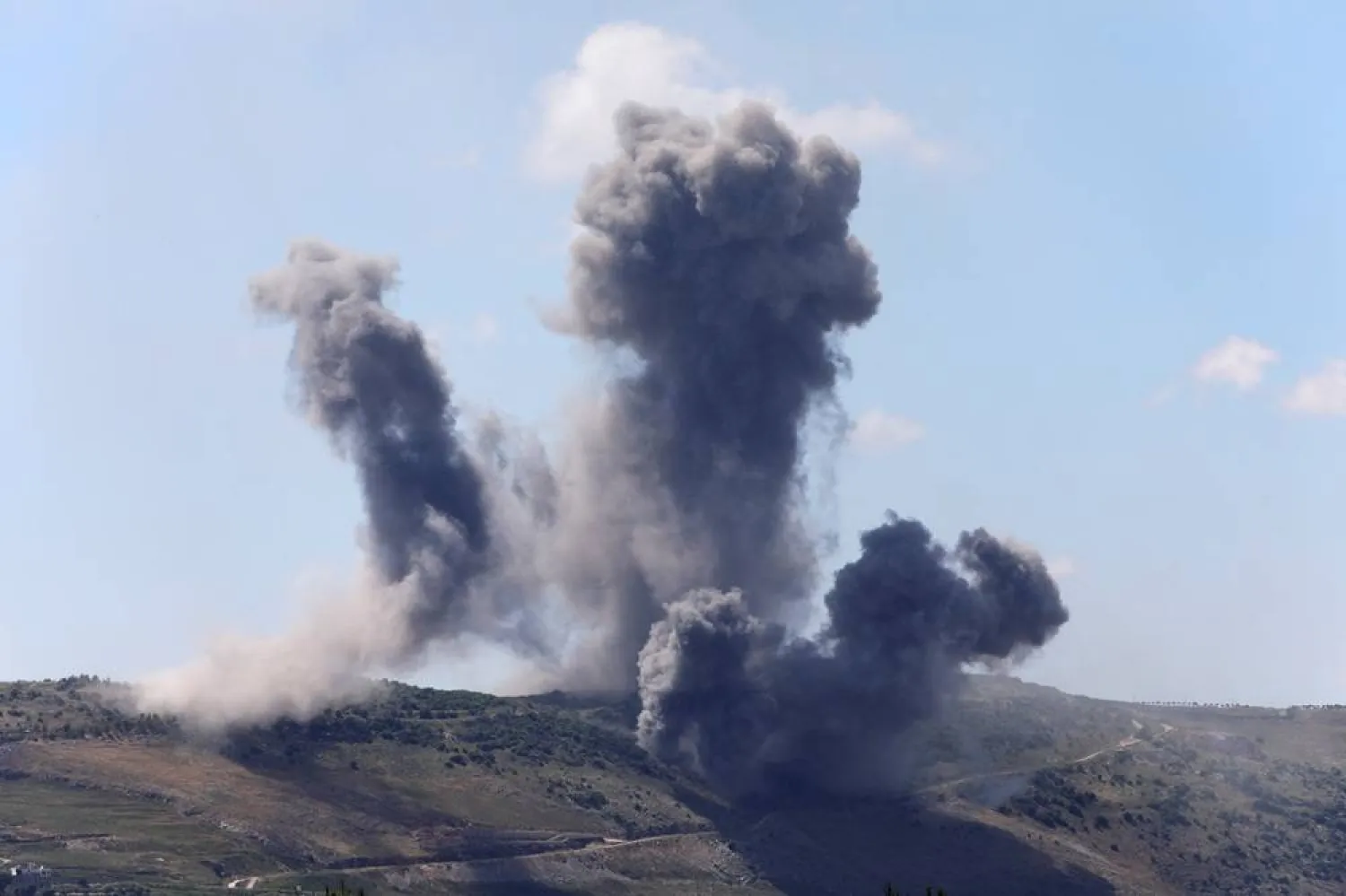 Plumes of smoke billow from southern Lebanon following Israeli strikes, as seen from Marjeyoun, Lebanon May 24, 2026. (Reuters)