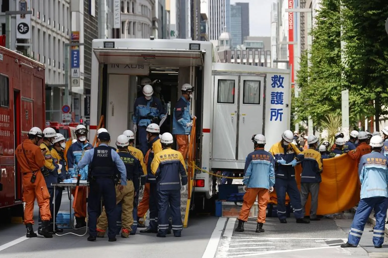 Emergency personnel work outside the Ginza Six luxury shopping complex in Tokyo's Ginza district, Japan, 25 May 2026. (EPA)