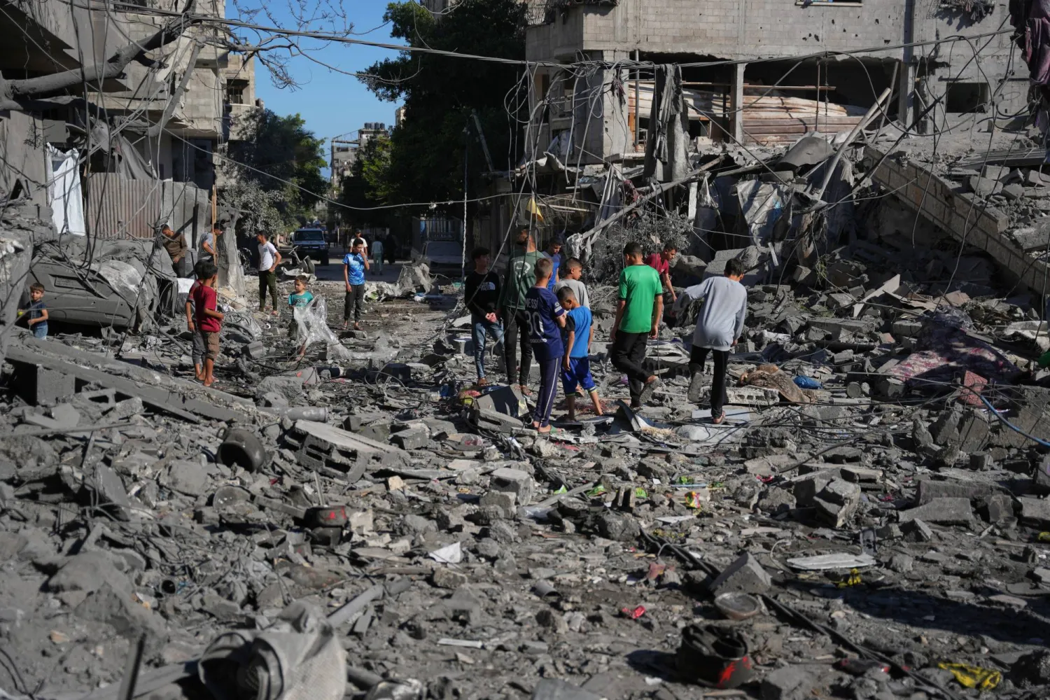 Palestinians inspect the rubble of a building destroyed in an Israeli airstrike in Nuseirat, central Gaza Strip, Tuesday, May 26, 2026. (AP Photo/Abdel Kareem Hana)