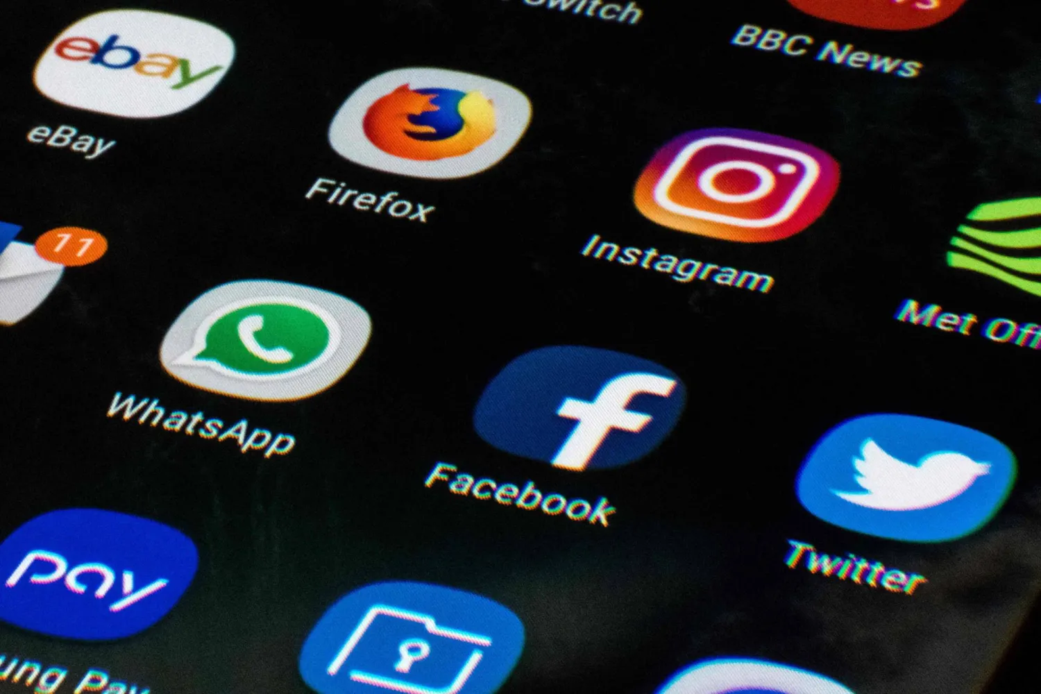 (FILES) This photo illustration shows a mobile phone screen displaying the icons for the social networking apps Facebook, Twitter and Instagram, taken in Manchester on March 22, 2018. (Photo by Oli SCARFF / AFP)