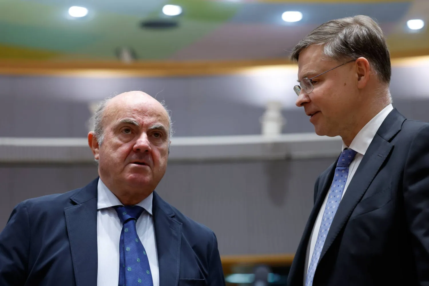 European Central Bank Vice-President Luis de Guindos, left, speaks with European Commissioner for Economy and Productivity, Implementation and Simplification Valdis Dombrovskis during a meeting of EU finance ministers at the European Council building in Brussels, Tuesday, May 5, 2026. (AP Photo/Geert Vanden Wijngaert)