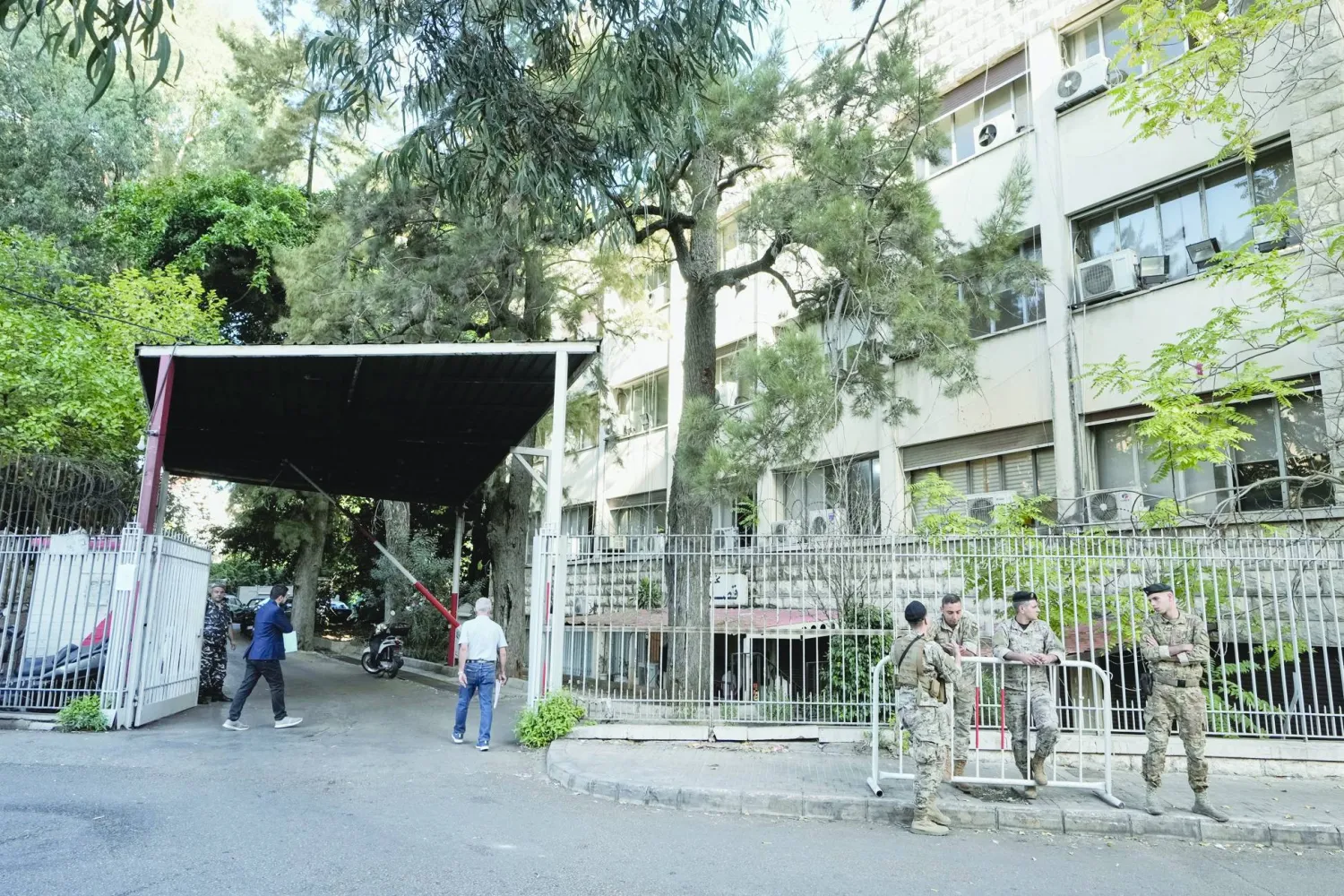 Lebanese soldiers stand guard outside the Justice Palace in Lebanon, Wednesday, Oct. 22, 2025. (AP Photo/Bilal Hussein)