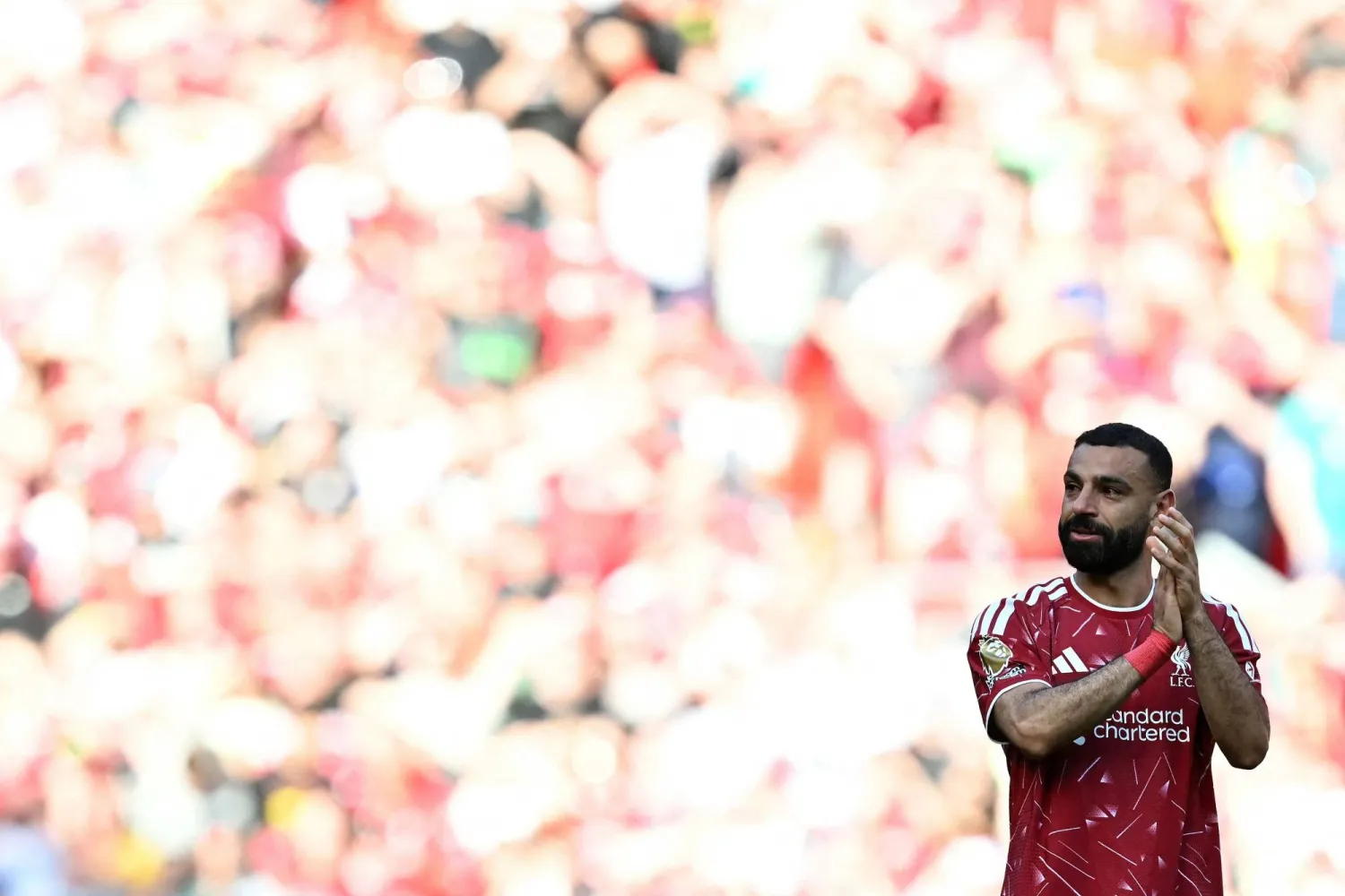 Liverpool's Egyptian striker #11 Mohamed Salah claps fans after the English Premier League football match between Liverpool and Brentford at Anfield in Liverpool, north west England on May 24, 2026. (AFP)